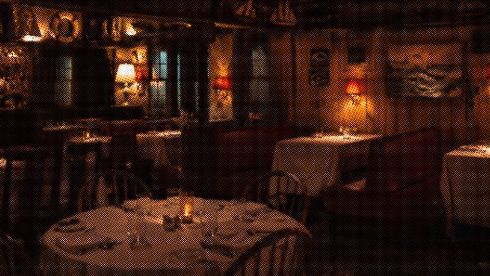 Candlelit tables inside Barnabus Tavern