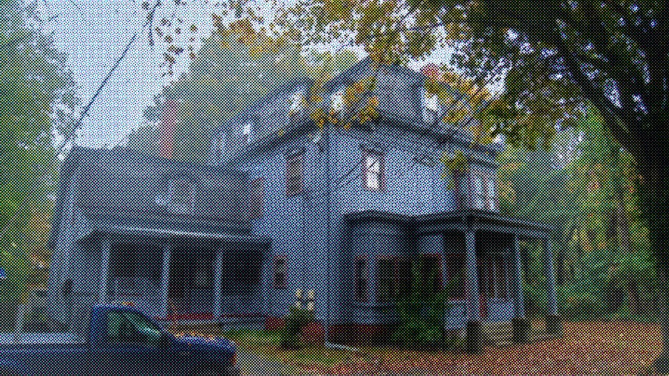 The Breakwater Inn beneath autumn trees