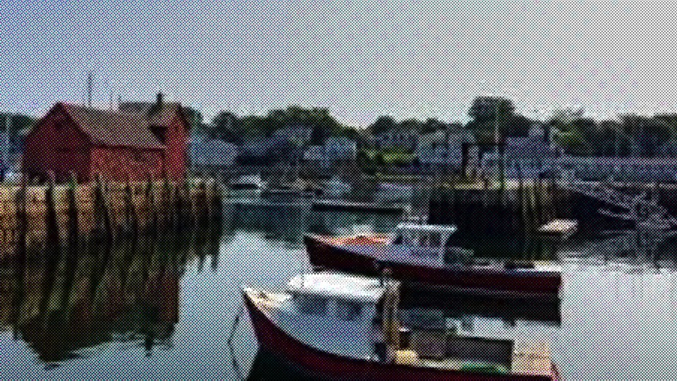 Fishing boats moored between the working piers