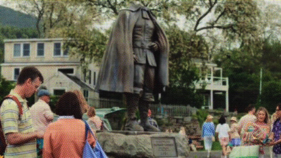 Visitors gathered around the founder's statue